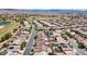 A panoramic view of a residential area, highlighting single-Gathering homes, mature trees, and a neighborhood with a golf course at 5577 Golden Leaf Ave, Las Vegas, NV 89122