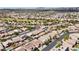 A picturesque aerial view of homes, mature trees, and green spaces, nestled around a golf course in the neighborhood at 5577 Golden Leaf Ave, Las Vegas, NV 89122
