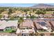 Aerial view of neighborhood featuring single-Gathering homes with well-kept lawns, mature trees, and a community golf course at 5577 Golden Leaf Ave, Las Vegas, NV 89122