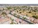 A high-angle view of a neighborhood featuring single-Gathering homes, mature trees, and a network of well-maintained streets at 5577 Golden Leaf Ave, Las Vegas, NV 89122