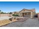 Landscaped backyard with fire pit, sitting area, and desert landscaping at 5577 Golden Leaf Ave, Las Vegas, NV 89122
