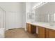 Bathroom featuring a double sink vanity and walk-in shower at 5577 Golden Leaf Ave, Las Vegas, NV 89122
