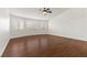 Spacious bedroom featuring wood floors and large windows at 5577 Golden Leaf Ave, Las Vegas, NV 89122