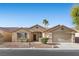 Charming single-story home featuring desert landscaping and a two-car garage at 5577 Golden Leaf Ave, Las Vegas, NV 89122