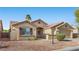 Attractive single-story home showcasing desert landscaping, shutters and a two-car garage at 5577 Golden Leaf Ave, Las Vegas, NV 89122