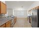Kitchen with stainless steel appliances, granite countertops and tile floors at 5577 Golden Leaf Ave, Las Vegas, NV 89122