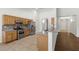 Kitchen features stainless steel appliances, tile floors, and breakfast bar at 5577 Golden Leaf Ave, Las Vegas, NV 89122
