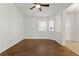 Bright living room features hardwood flooring and a ceiling fan at 5577 Golden Leaf Ave, Las Vegas, NV 89122