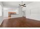 Open living room features hardwood floors and a ceiling fan at 5577 Golden Leaf Ave, Las Vegas, NV 89122