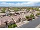 A street view of single-Gathering homes, green lawns, and mature trees, offering a glimpse into the peaceful neighborhood at 5577 Golden Leaf Ave, Las Vegas, NV 89122