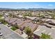 A high angle street view featuring well maintained homes with lawns, mature trees, and a serene residential neighborhood at 5577 Golden Leaf Ave, Las Vegas, NV 89122