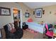 Quaint bedroom with a daybed, cozy chair, and colorful decor, perfect for relaxation at 6705 Old Newbury Ave, Las Vegas, NV 89108