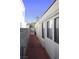 Side yard showcasing a well maintained walkway and block wall for privacy at 6705 Old Newbury Ave, Las Vegas, NV 89108