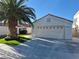 Charming single-story home featuring a two-car garage, terracotta roof and inviting desert landscaping with artificial turf at 6705 Old Newbury Ave, Las Vegas, NV 89108