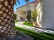 Inviting desert landscaping with artificial turf leads to this single story home with cozy front porch at 6705 Old Newbury Ave, Las Vegas, NV 89108