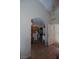Inviting hallway entrance with wood-look tile and arched doorway leading to the kitchen area at 6705 Old Newbury Ave, Las Vegas, NV 89108