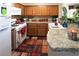 Well-maintained kitchen offering wood cabinets, granite countertops, and updated appliances at 6705 Old Newbury Ave, Las Vegas, NV 89108