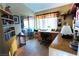 Inviting home office with ample desk space, natural light, and built-in bookshelves at 6705 Old Newbury Ave, Las Vegas, NV 89108