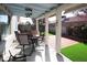 Inviting covered patio with outdoor seating and access to a low maintenance backyard at 6705 Old Newbury Ave, Las Vegas, NV 89108