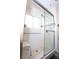 Accessible bathroom showcasing a spacious shower with a seat, grab bars, and tile accents at 6705 Old Newbury Ave, Las Vegas, NV 89108