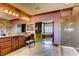 Bathroom with double vanity sinks, large mirrors, walk-in shower, and walk in closet at 7210 El Malpais St, Las Vegas, NV 89118