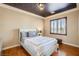 Nicely appointed bedroom showcasing a decorative ceiling, wood flooring and window with shutters at 7210 El Malpais St, Las Vegas, NV 89118