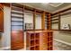Walk-in closet features custom shelving, drawers, and ample storage space at 7210 El Malpais St, Las Vegas, NV 89118