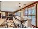 Open-concept dining area adjacent to the kitchen, featuring a large dining table and decorative lighting at 7210 El Malpais St, Las Vegas, NV 89118