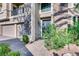 Lovely front entrance shows stone accents, desert landscaping, an elegant door, and a three-car garage at 7210 El Malpais St, Las Vegas, NV 89118