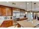 Large kitchen with stainless steel appliances, granite countertops, and a spacious island with seating at 7210 El Malpais St, Las Vegas, NV 89118