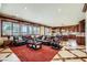 Open-concept living area showcasing tile floors, custom cabinets, and large windows overlooking the exterior at 7210 El Malpais St, Las Vegas, NV 89118