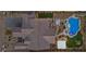 Aerial view showcasing the home, pool with spa, outdoor kitchen, fire pit, and landscaped backyard at 7277 W Landberg Ave, Las Vegas, NV 89178