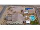 Aerial view of property highlighting the home, pool, tennis court, outdoor kitchen, and landscaped backyard at 7277 W Landberg Ave, Las Vegas, NV 89178