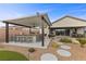 Outdoor barbecue area that offers bar seating, lounge area, and stepping stones at 7277 W Landberg Ave, Las Vegas, NV 89178