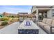 Relaxing backyard featuring a fire pit, built-in barbecue, outdoor seating, and well-manicured landscaping at 7277 W Landberg Ave, Las Vegas, NV 89178