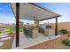 Backyard with a built-in barbecue area, bar seating, and outdoor play structure at 7277 W Landberg Ave, Las Vegas, NV 89178