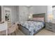 Charming bedroom featuring a decorative bed frame, desk with chair, and neutral walls creating a cozy space at 7277 W Landberg Ave, Las Vegas, NV 89178