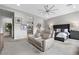 Comfortable bedroom featuring a seating area, a ceiling fan and calming neutral decor at 7277 W Landberg Ave, Las Vegas, NV 89178