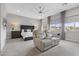 Modern main bedroom features a sitting area, large windows, and contemporary decor at 7277 W Landberg Ave, Las Vegas, NV 89178