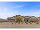 Beautiful single-story home featuring desert landscaping and a three car garage at 7277 W Landberg Ave, Las Vegas, NV 89178