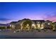 Beautiful home with a landscaped front yard featuring decorative rock and mature trees at 7277 W Landberg Ave, Las Vegas, NV 89178