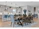 Well-lit kitchen and dining space with a table, chairs and an island with barstools at 7277 W Landberg Ave, Las Vegas, NV 89178