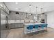 Bright kitchen featuring grey cabinets, a large island with seating and stainless steel appliances at 7277 W Landberg Ave, Las Vegas, NV 89178