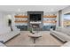 Stylishly decorated living room featuring a fireplace, wall shelves and tile flooring at 7277 W Landberg Ave, Las Vegas, NV 89178