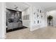 An office features a unique accent wall, a desk and chair, as well as unique artwork and decor at 7277 W Landberg Ave, Las Vegas, NV 89178