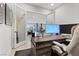Bright office featuring French doors, a view to the backyard, and a large desk with ergonomic chair at 7277 W Landberg Ave, Las Vegas, NV 89178