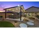 This modern outdoor kitchen is perfect for entertaining with a built-in grill and ample seating at 7277 W Landberg Ave, Las Vegas, NV 89178