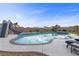 Inviting backyard pool with slide, playset, and spa offers ample space for outdoor fun at 7277 W Landberg Ave, Las Vegas, NV 89178