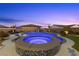 Stunning pool with spa, slide, and lush landscaping creates a backyard oasis for relaxation and entertainment at 7277 W Landberg Ave, Las Vegas, NV 89178