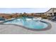An inviting backyard featuring a pool, spa, slide, and playset for ultimate outdoor enjoyment at 7277 W Landberg Ave, Las Vegas, NV 89178